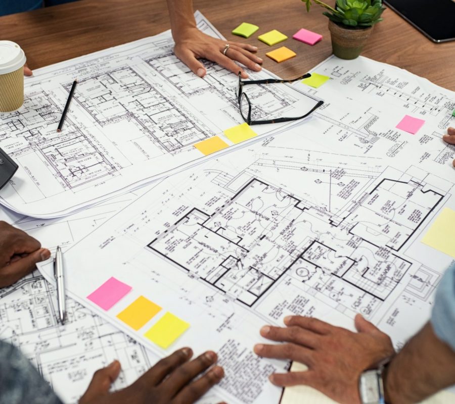 Architects working on blueprints
